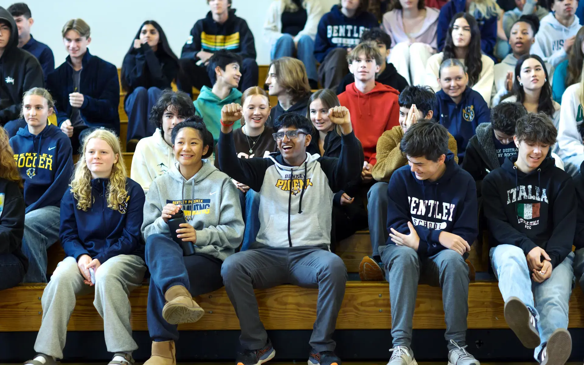 Upper School students cheer from the bleachers at a Spirit Rally.