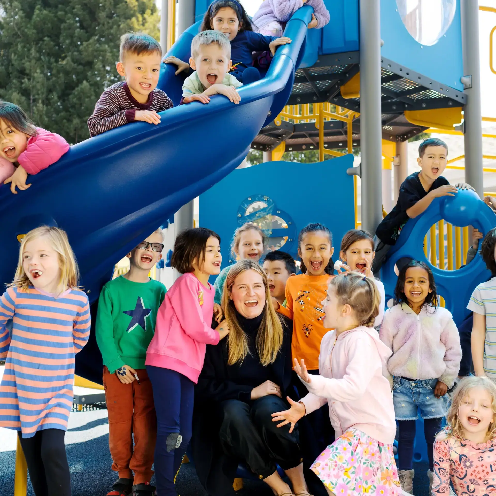 Students next to playground equipment