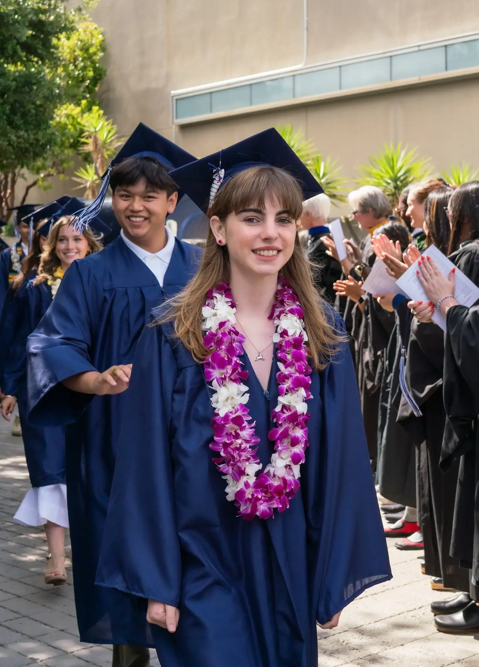Senior walks through the faculty line at Graduation.
