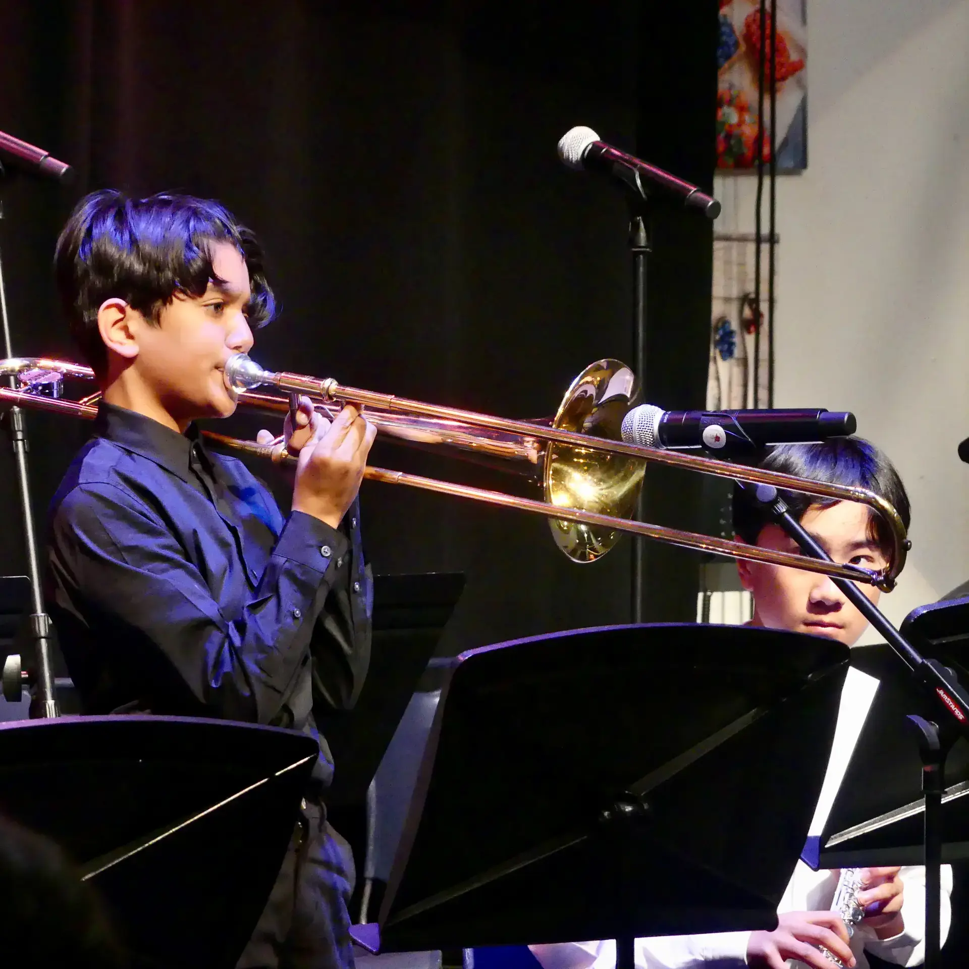 Student playing brass instrument