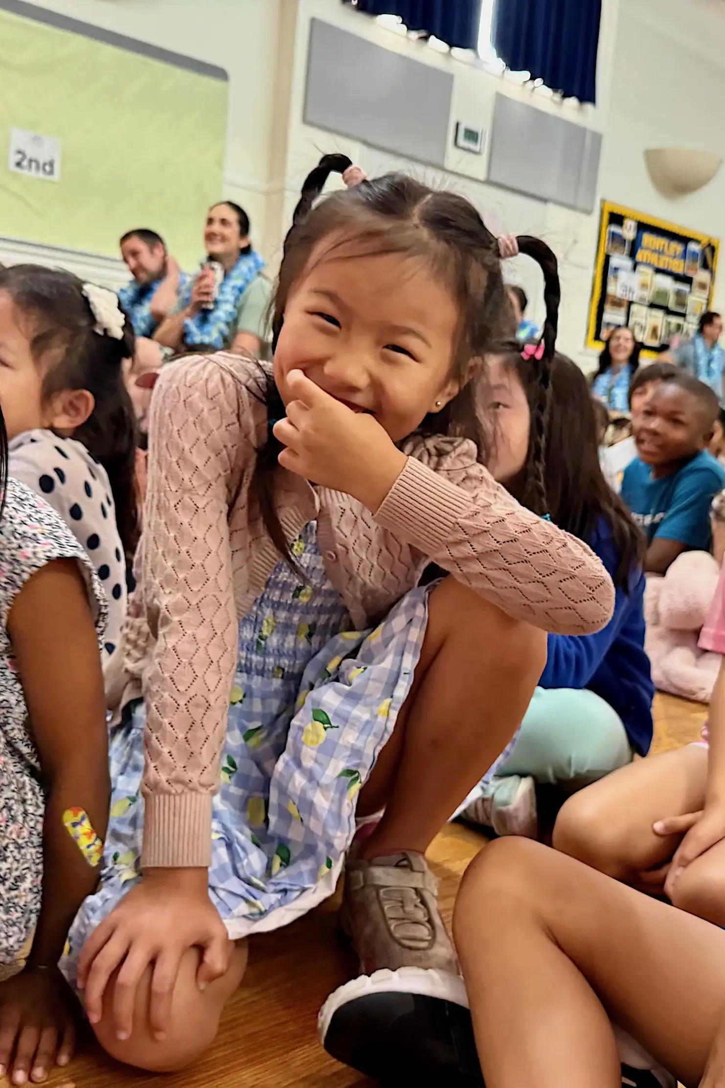 Lower School students giggle during the Step-Up Ceremony.