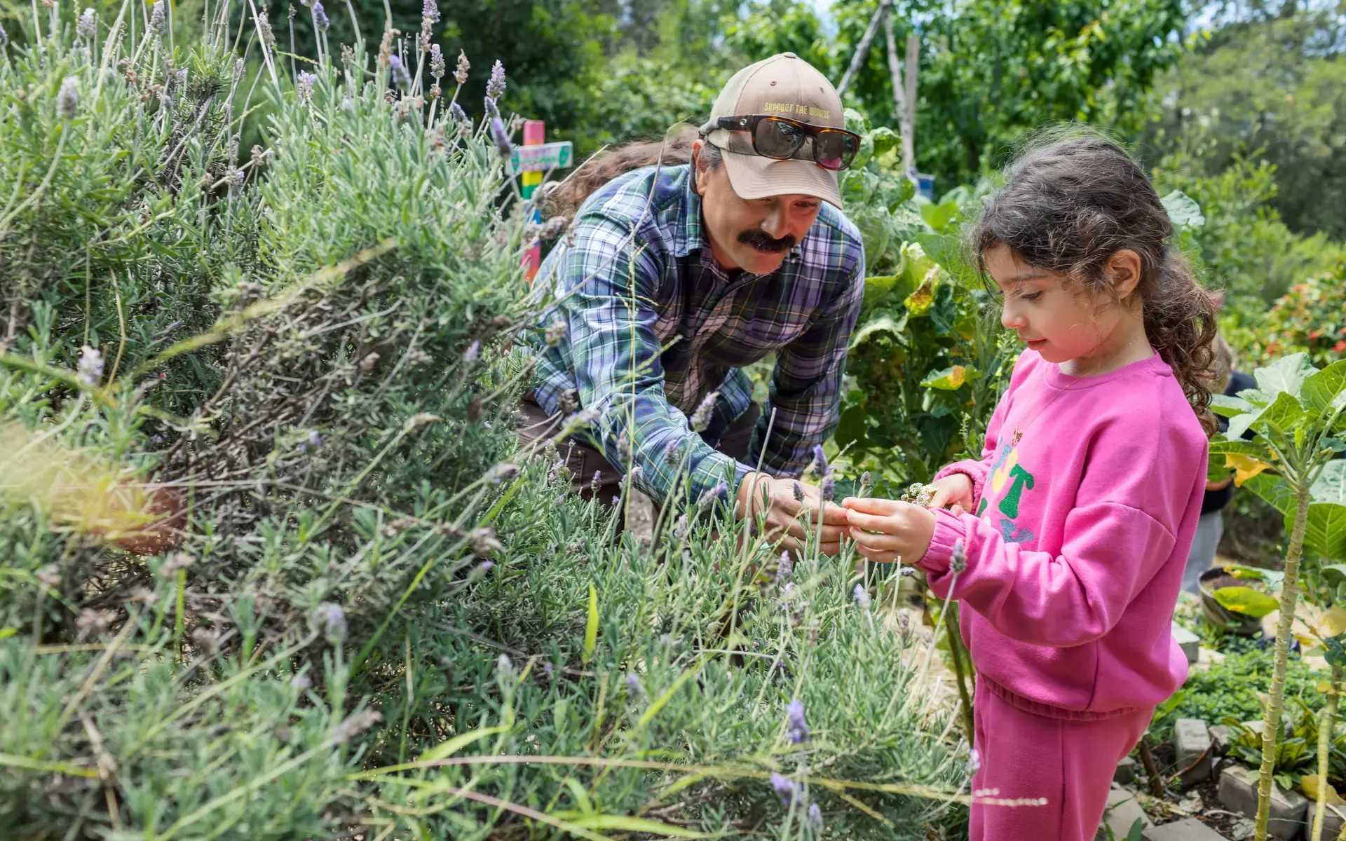 Garden teacher with a Lower School girl in the Hiller Garden.
