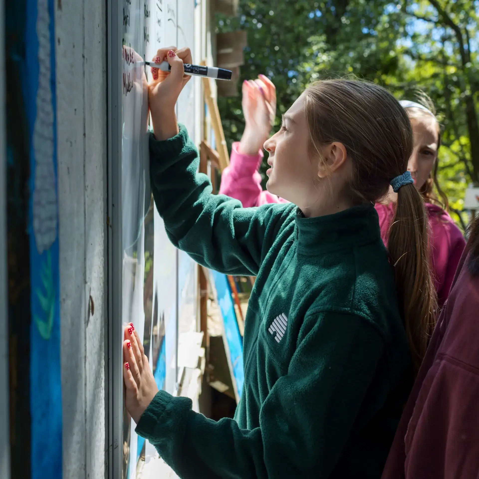 Student writing on board