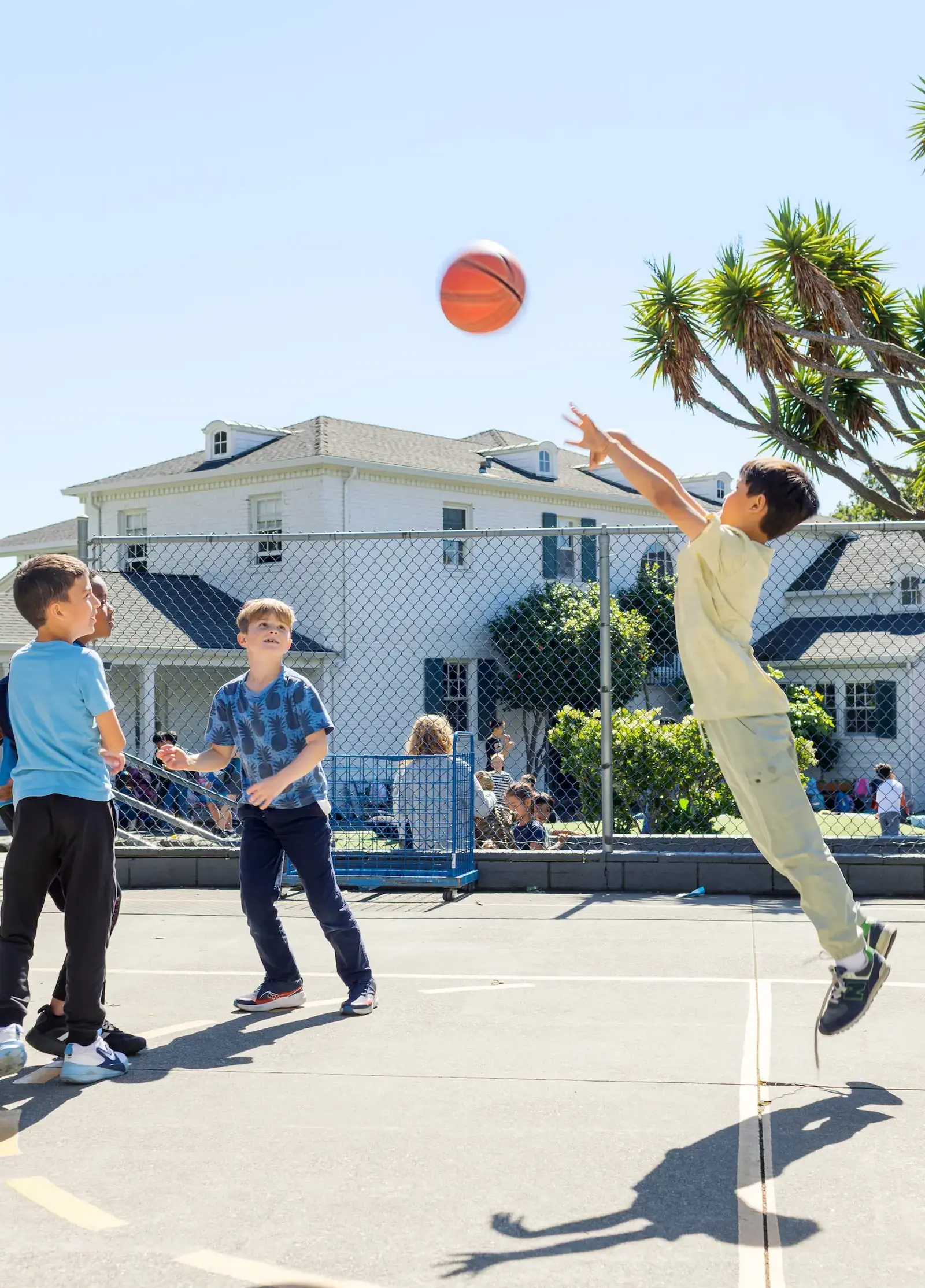 Lower School boys play basketball on the Ball Deck.