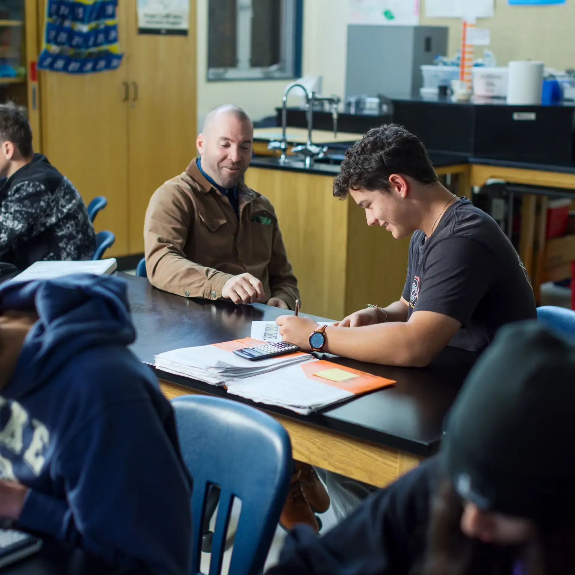 Student and teacher working collaboratively during class