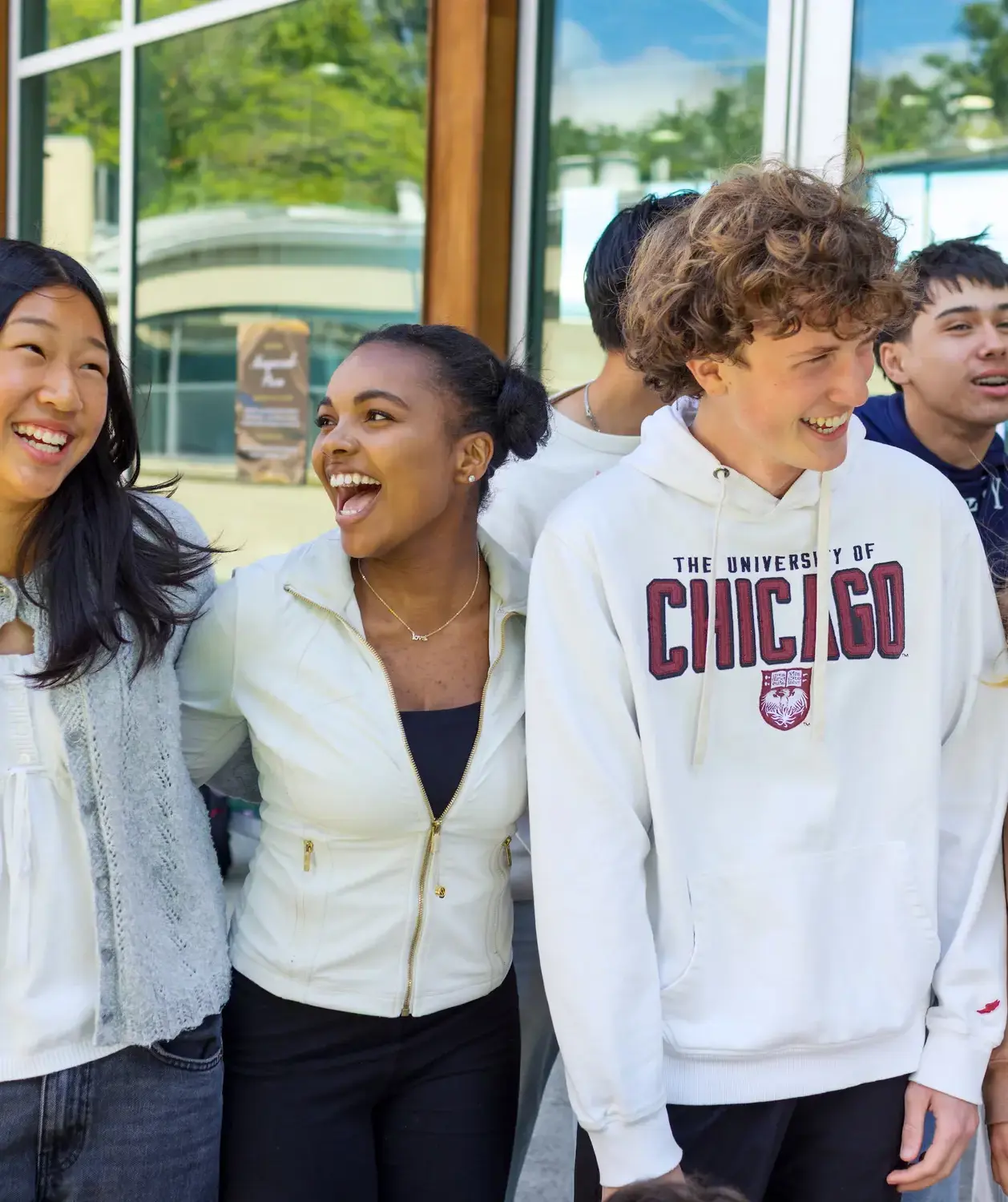 Candid photo of Upper School students laughing in front of The Commons