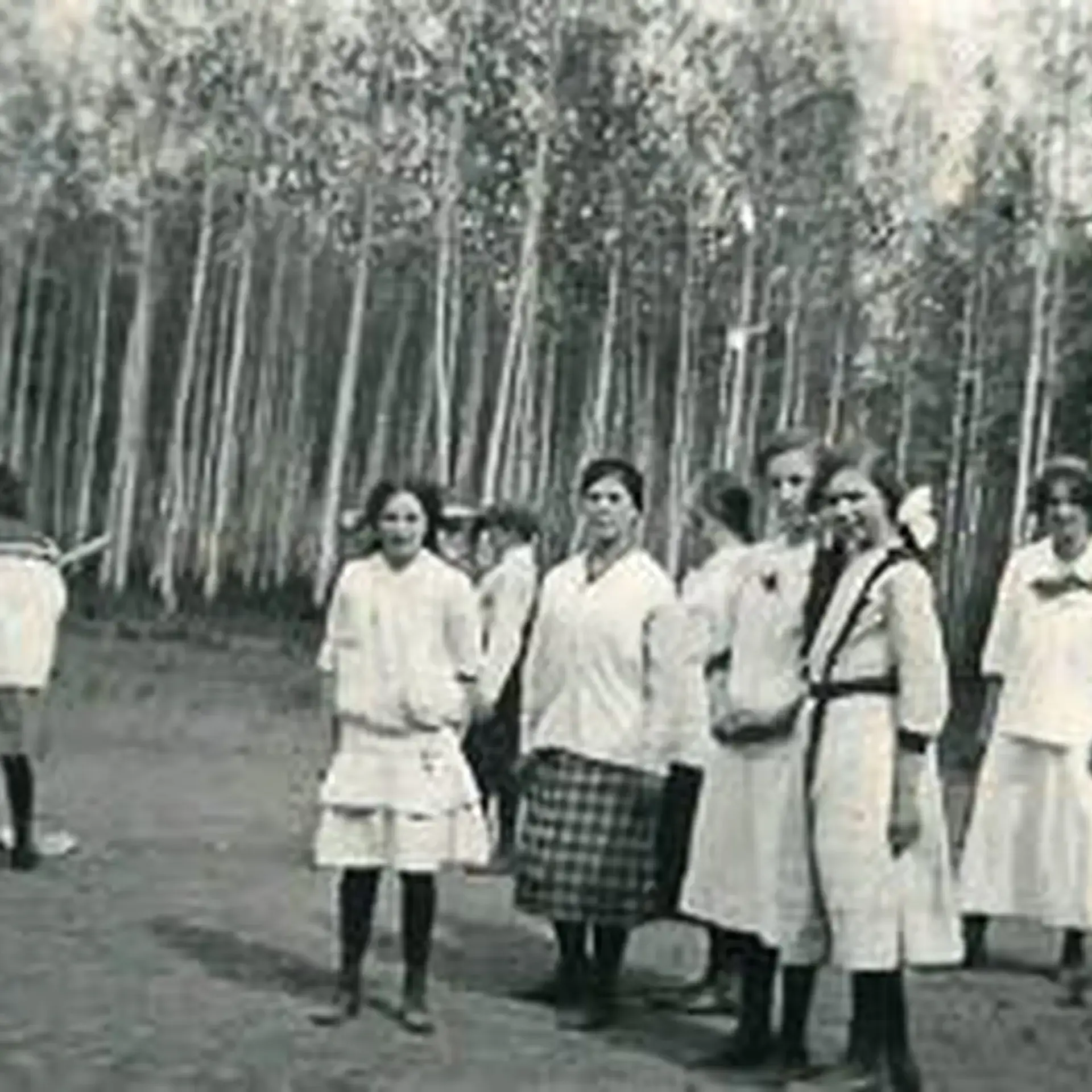 Archival photograph of group standing in field